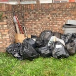 17 bags & misc household 17 bags containing plastic bags/paper/ miscellaneous household items, 1 cardboard box, 3 mops,bucket, 2 walking sticks, 1 curtain rail, 1 roll vinyl flooring. SE2 - removed for £100