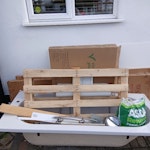 Bathroom waste Fibreglass bath, sink pedstal, wall panelling, cardboard packaging, wood pallet and small amount of general waste and metal. DA14 - removed for £80