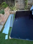 Broken solar panel, panel and broken solar panel pallet and small associated rubbish nearby TW12 - removed for £120