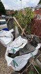 3x1 cubic yd, bamboo,waterbutt 3x1 cubic yard bags of garden waste

One of the bags has a large amount of Ikea wooden outdoor parquet-style flooring (not reusable)

Bamboo
 
Water butt that was converted into a strawberry planter, filled with soil 

Collapsed outdoor sofa

All visible from the roadside, with access though a gate SO17 - removed for £400