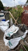 3x1 cubic yd, bamboo,waterbutt collected by T & O waste services