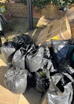 Mainly garden waste ~25 bags ~20 bags of lawn/turf,
~5 bags of mixed rubbish,
Parasol & parasol base.
Easy access. The rubbish are on the back of the house. There is side access and large driveway. KT2 - removed for £95