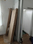Flooring buckets plasterboard Large cardboard boxes and plasterboard. Buckets, empty bin, bags of vinyl floor, bags of insulation, wooden boards, parts of old stud wall NW10 - removed for £100
