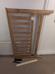 King bed frame (dismantled) Mixture of wood, plywood & metal. Longest wooden planks are ~200cm. Headboard is 110*160cm. Some parts are broken so it won't function as a bed frame anymore unfortunately. LE2 - removed for £50