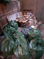 garden waste bags and rubble collected by waste management group