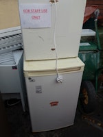 Three small refrigerators collected by Clear and Away