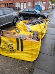 two bags discarded furniture Discarded/broken sofa, wood from cupboard, cardboard mattress W13 - removed for £140