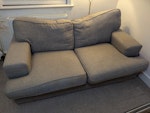 2-seater sofa Grey 2-seater sofa. Light stains and watermarks (see photo for the worst of it), dust in crevices, upholstery/cushions need a clean if being reused. Fire safety tag present. Cushions removable, body one piece. 2nd-floor flat, 2-person job to get down the stairs, I can help if needed. Parking behind building at weekends or after 7 PM on weekdays. GU1 - removed for £60