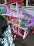 Small car load Barbie dream house a wet rug garden parasol and metal stand some plastic planters some card boxes and a few bags of garden waste. RM1 - removed for £100