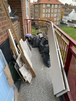 Some tiles and wood collected by JLC WASTE MANAGEMENT LIMITED