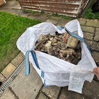 Two ton bags of red brick rubb collected by Long Gone Waste Diposal