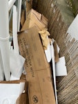 Cardboard and packaging waste Mostly flattened cardboard boxes and packaging materials (from a recent house move), plus some polystyrene, bubble wrap, a small old TV, and a small wooden step stool. Easy access through passageway just over the low fence. No heavy items. SE9 - removed for £100