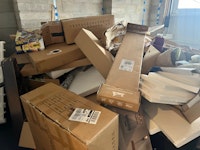 boxes &bin with clothes, toys collected by Clear and Away