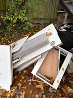 Old wood desk and shelves collected by JLC WASTE MANAGEMENT LIMITED