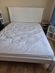 Kingsize bed and mattress Kingsize John Lewis bedframe in excellent condition. Headboard is solid wood i believe - it is heavy. Sprung slats. We have spare slats too. Plus mattress. EN2 - removed for £140