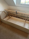 single upholstered bed single bed cotton canvas upholstered, got damaged during house move on the side upholstery, some stains. pop up under bed storage working perfectly 
90x190cm SW19 - removed for £105