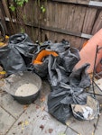 10 lightly filled rubble bags most quarter filled with some quarry tiles (to keep weight down). couple buckets and a bit of ditre mat SW11 - removed for £90