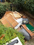 Front garden full of rubbish End of renovation project crap

- wet cardboard
- packaging
- random wooden frames
- think there’s some rolled up carpet at the bottom

- no rubble or debris

has been left out in the rain E8 - removed for £120