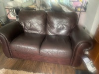 two leather sofas collected by Clear and Away