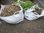 Gravel/rubble bulk bag Approx 1.2 bulk bags of gravel.  (One bag full, and a second bag only partially full.)  Some soil/hardcore and weed membrane fabric mixed in. Easy access at the front of a double driveway with a wide area to turn a car around in - see photo. (Don't collect the leaves/branches behind the bags of gravel.) BS16 - removed for £117