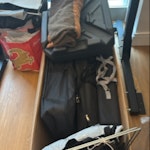 2 largue boxes of junk old Crook por, tupperware, merchandising unused SE1 - removed for £114