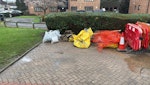 Assorted waste. Slabs, sand 3 bags of assorted waste, several broken paving slabs, two yellow bags with sand at bottom, red mesh, one traffic cone. Do not collect the safety barriers. EN3 - removed for £371