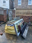 Hippo Megabag + extra items Hippo megabag mostly filled with floor & roof tiles, brick work & wood. Additional items: thick glass panel, wood & glass door, wood frame, bed frame parts, wake board & 4 rusted iron chairs. BN22 - removed for £500