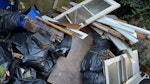 large pile building rubble Lots of bags of heavy builders rubble; wood, (including doors, and an old floor that was taken up), radiators, etc BN2 - removed for £352
