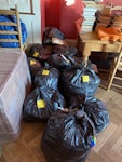 54bags waste-textiles; 13boxes There are 54 bags of junk: some is rubbish, the rest is clothes and linen for recycling, plus some duvets and pillows. There are also 13 boxes of kitchen appliances/crockery/pans for recycling or waste. W11 - removed for £200