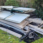 Garden clear-out waste Pile of plastic panels from the removal of a plastic garden shed. Pile of assorted garden waste comprised mostly of wood with metal poles and other assorted waste (as per pictures). BR3 - removed for £214