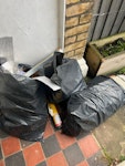 Random rubbish few bags of DIY rubbish inc some old carpet bits, small pile of cardboard boxes, disasembled mdf bookshelves (larger pieces can be taken whole or broken into smaller pieces to fit the car, depends if you want to reuse them), 2 2 wooden palets SE26 - removed for £143
