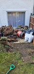 Garden clean-out (wood/bricks) Pile of wood (mostly rotten) containing pallets/ply wood/chairs. Pile of bricks/garden ornaments (heavy). Rubble bags: 9 black bags (not heavy); 4 white bags (heavy but can be lifted by one person). Some plastic plant pots as per pictures. BR3 - removed for £229
