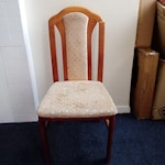 Furniture removal: 4 chairs Four wooden dining chairs with upholstered seats and backs. The frames are medium-toned wood and generally intact; however, the top section of the frame is partially broken, as shown in the photo. Upholstery is light-coloured fabric with visible wear and staining from regular household use. Chairs show overall cosmetic and structural deterioration and are no longer suitable for use. Items are presented as household furniture waste for collection. N1 - removed for £71