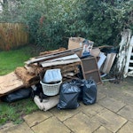 pavers, stone, loft + househol Photos show the rough amount (mini skip) lumps of stone, offcuts of porcelain paving, wood, old loft straw insulation boards, general household waste, some plastic goods. Would need a small van RH7 - removed for £156