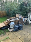 pavers, stone, loft + househol Photos show the rough amount (mini skip) lumps of stone, offcuts of porcelain paving, wood, old loft straw insulation boards, general household waste, some plastic goods. Would need a small van RH7 - removed for £156