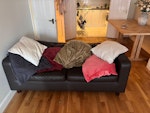 A sofa that needs removal A two person black leather sofa that I need gone today, can be picked up in a minute as right by front gate SE16 - removed for £97