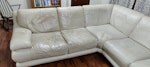 corner sofa (2.5m x 2.5m) A cream leather corner sofa that can split into two pieces for transportation. The leather on three seat cushions requires attention (see photos) ST5 - removed for £123