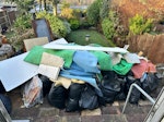 rubble, insulation, timber House renovation building waste including rubble, timber, old loft insulation, radiators and carpet. 
piles are located on patio and in garage to rear of garden accessible via road in park to rear. 
Requires medium sized van as bollards along road out front limit access to driveway so no big lorries. N14 - removed for £429