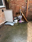 Rubbish removal. Pain tins
sign holder x 3
brushes/mops
bread basket
white door
scrap/bricks in corner
Cardboard
Plastic in corner next to the sign holders. CV21 - removed for £333