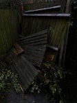 Fence wood & garden debris Fence wood & garden debris

****One piece of the trash is in the backyard of the neighbor of apartment A because it has a side gate for access,  and the other is at the entrance to the garage of apartment A - Both accessible, but in two different places****. W4 - removed for £294