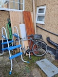 Wood, bike parts, pool steps Pieces of chipboard wood,a piece of insulation, a bike without front wheel and pool steps HA8 - removed for £117