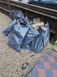 Approx 15 bags of wood Parts from rotten garden fence panels & posts that needed replacing. I have COPD & cannot lift or carry anything heavy & the council will not take KT6 - removed for £111