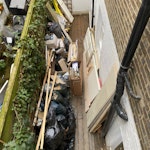 Lots of timber, empty cans etc lots of timber, two doors, two pallets, empty cans, a few sacks of rubble, a porcelain kitchen sink etc N7 - removed for £352