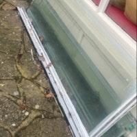 skip bag full and glass panels collected by Long Gone Waste Diposal