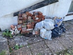 Old bricks and bags of rubble Old bricks, concrete and rendering, the material from an old chimney stack which the builder has rebuilt. BS9 - removed for £214