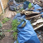 Garden waste and rubble garden waste including 3 broken fence panels and small branches. Approx 35 small bags of rubble and a couple of broken pots. In back garden but accessible directly by side entrance E6 - removed for £314