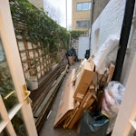 Some timber, rubble, cardboard Demolished decking boards, rubble sacks filled with shingles, some packaging etc. N7 - removed for £258