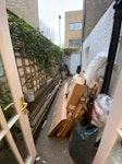Some timber, rubble, cardboard Demolished decking boards, rubble sacks filled with shingles, some packaging etc. N7 - removed for £258