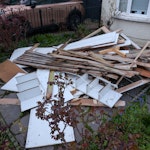 Mostly wood and chipboard Wood and chipboard waste from a built in cupboard and old wardrobe that has been dismantled. Elderly wooden fence panel. Also one thin metal curtain rail. N21 - removed for £130