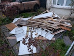 Mostly wood and chipboard Wood and chipboard waste from a built in cupboard and old wardrobe that has been dismantled. Elderly wooden fence panel. Also one thin metal curtain rail. N21 - removed for £130